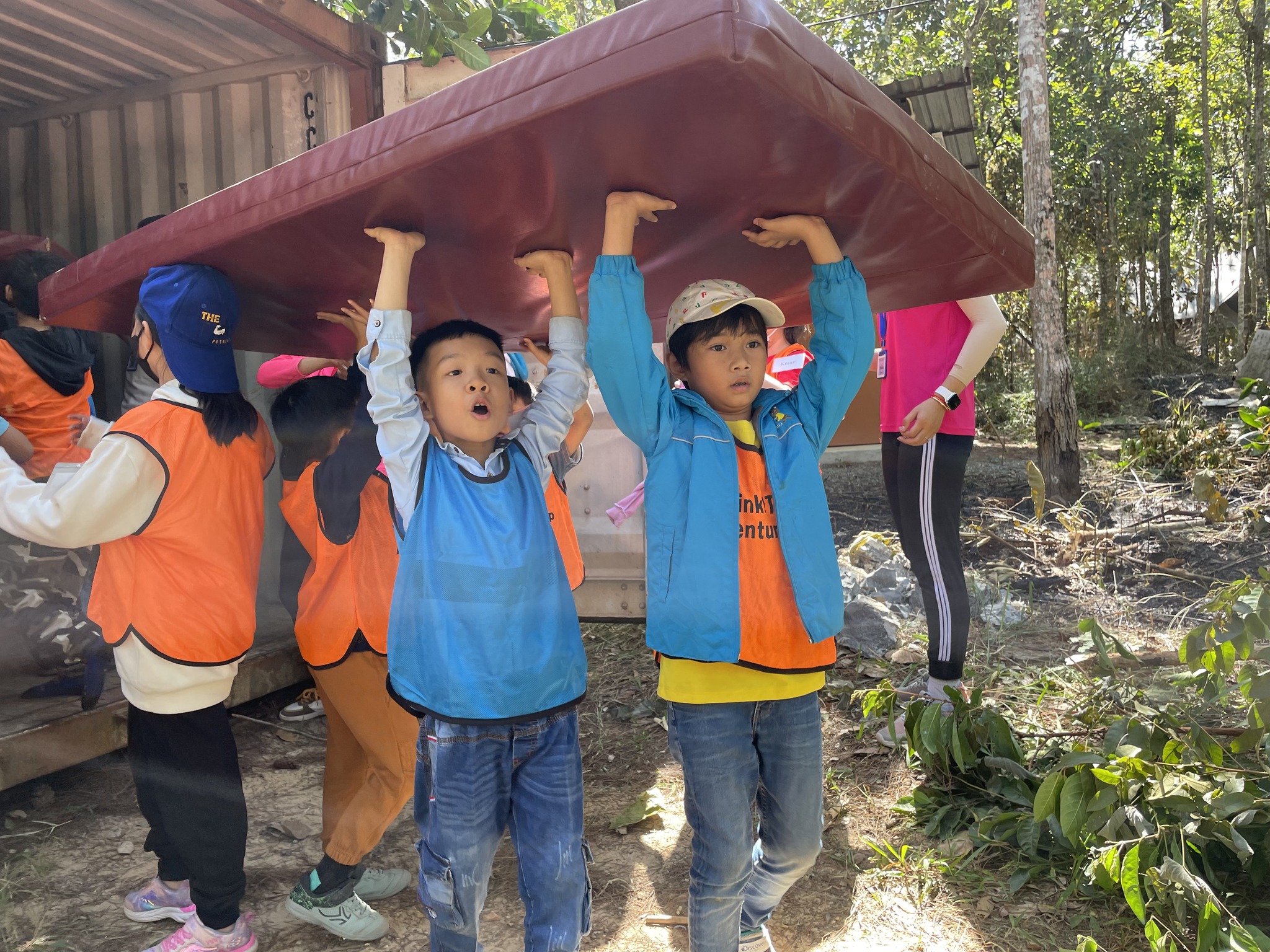 Children lifting a tent